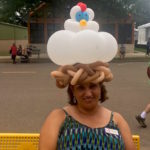 Balloon Twisting Mandana wearing Chicken Hat