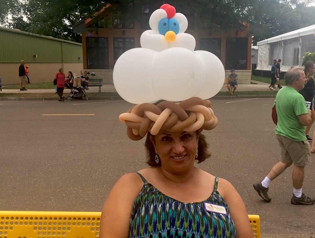 Balloon Twisting Mandana wearing Chicken Hat