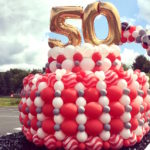 Giant Balloon Cake 50th Anniversary on Parade float